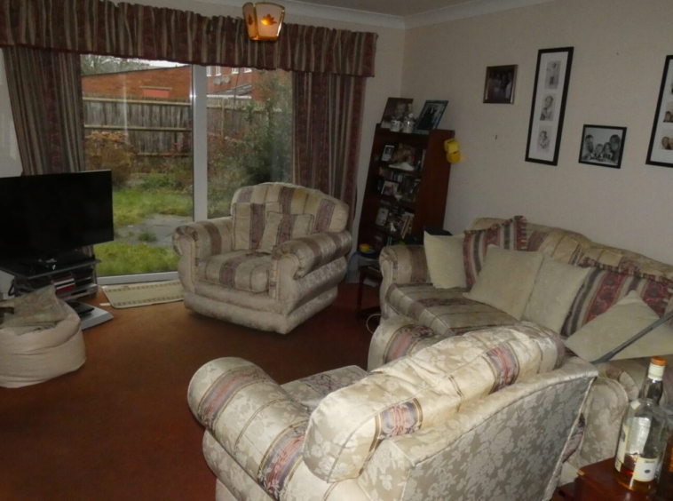 Lounge including furniture and television